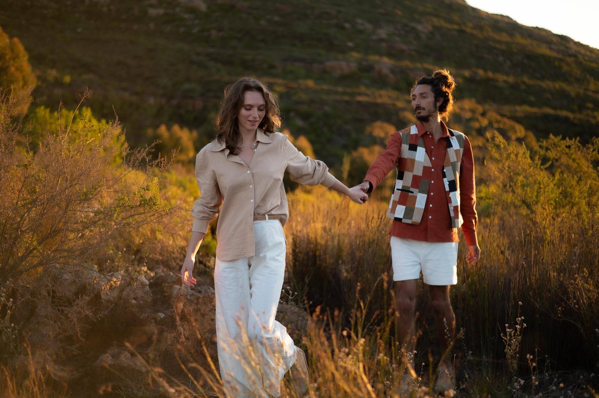 woman and man in field wearing hemp linen clothing made by Sage & Sunday a cape town clothing brand