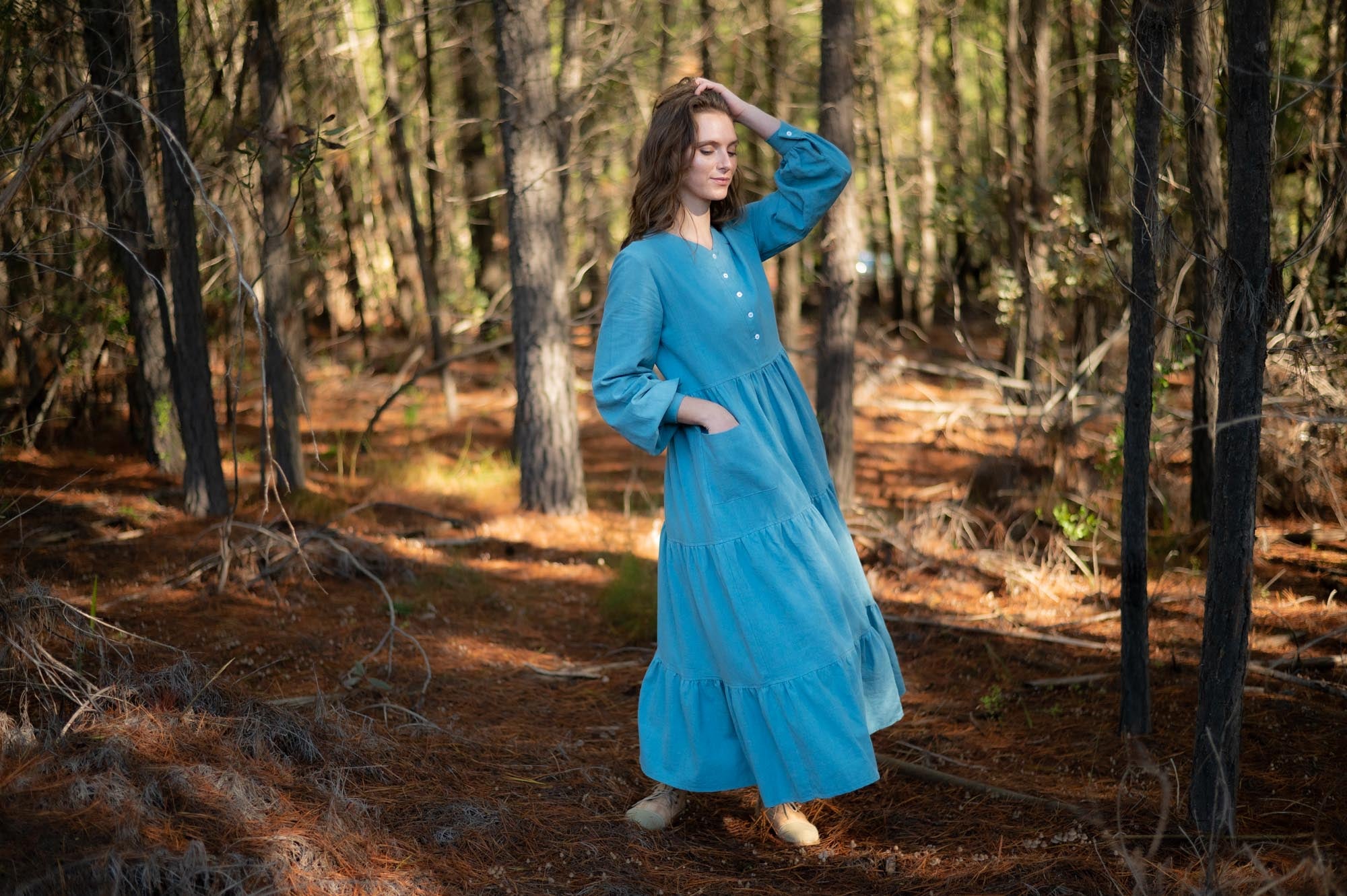 women wearing a blue hemp linen maxi dress made by Sage & Sunday a cape town clothing brand