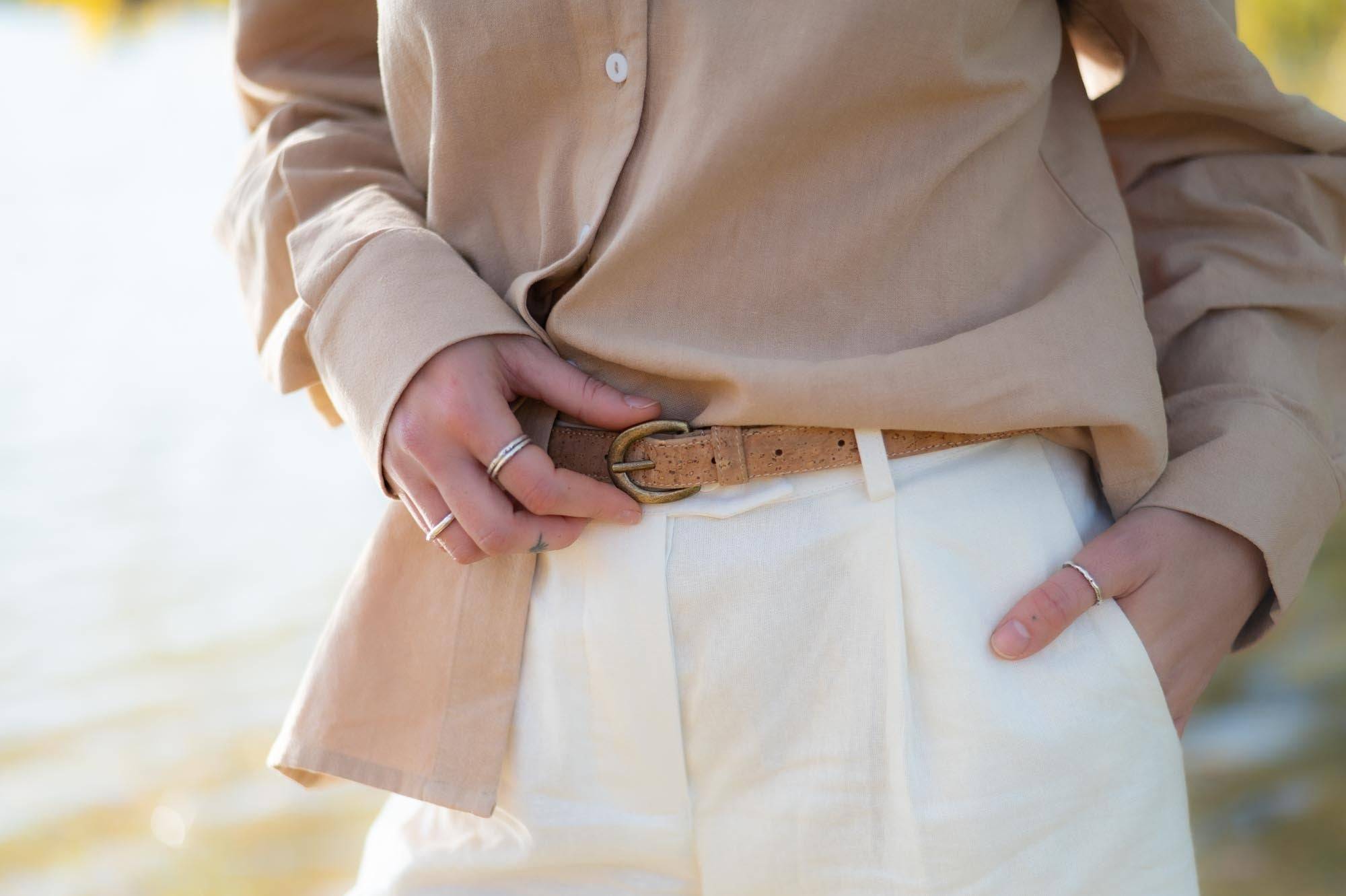 women showing off her cork leather belt made by Sage & Sunday a cape town clothing brand