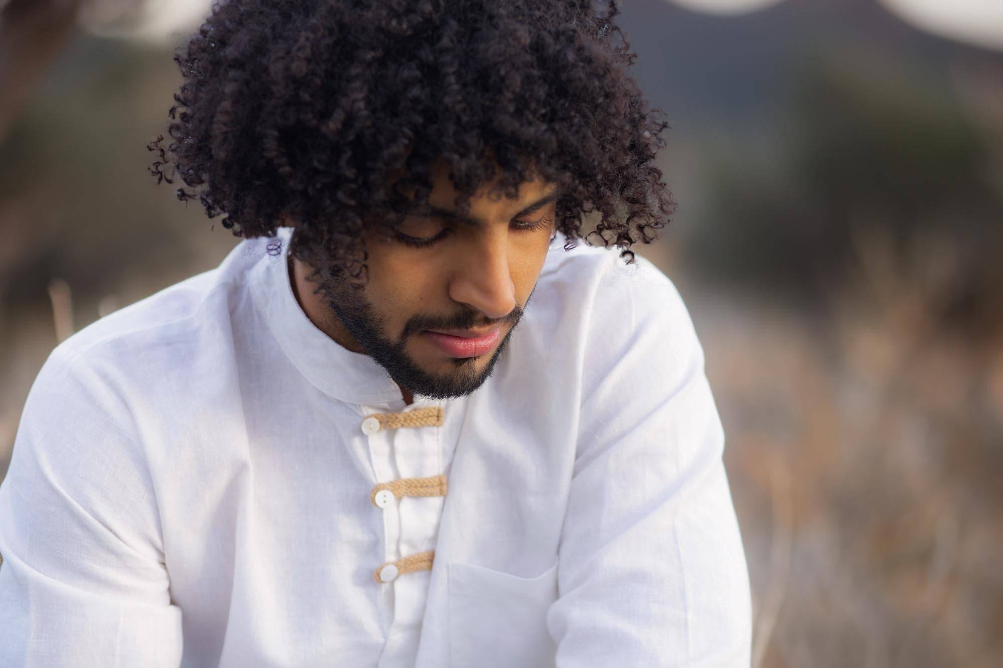 man wearing white hemp linen shirt made by Sage & Sunday a cape town clothing brand